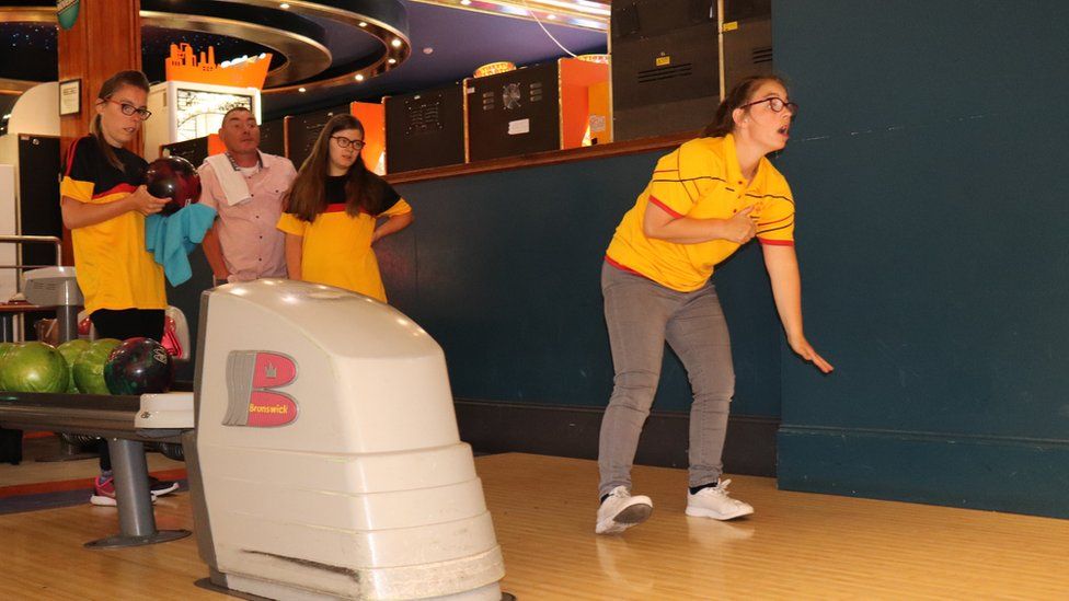 The sisters bowling.