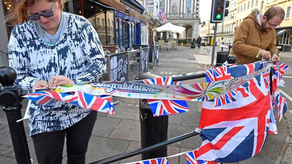 People string up bunting, on the day before the royal wedding of Britain's Princess Eugenie and Jack Brooksbank, in Windsor, Britain, October 11, 2018