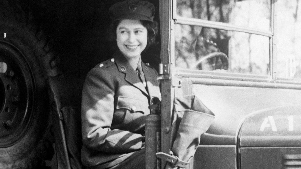 A picture of the Queen at the wheel of an Army vehicle in 1945