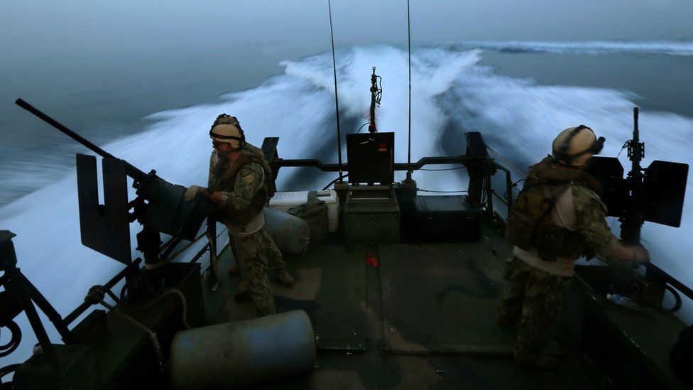 US military personnel on a riverine patrol boat