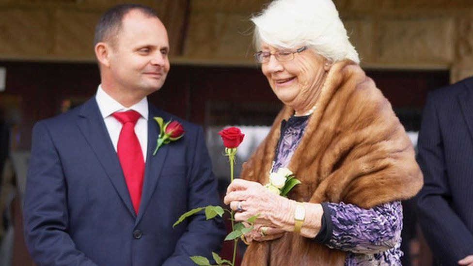 Andrew (left) and his mother, Helen, (right) at his wedding