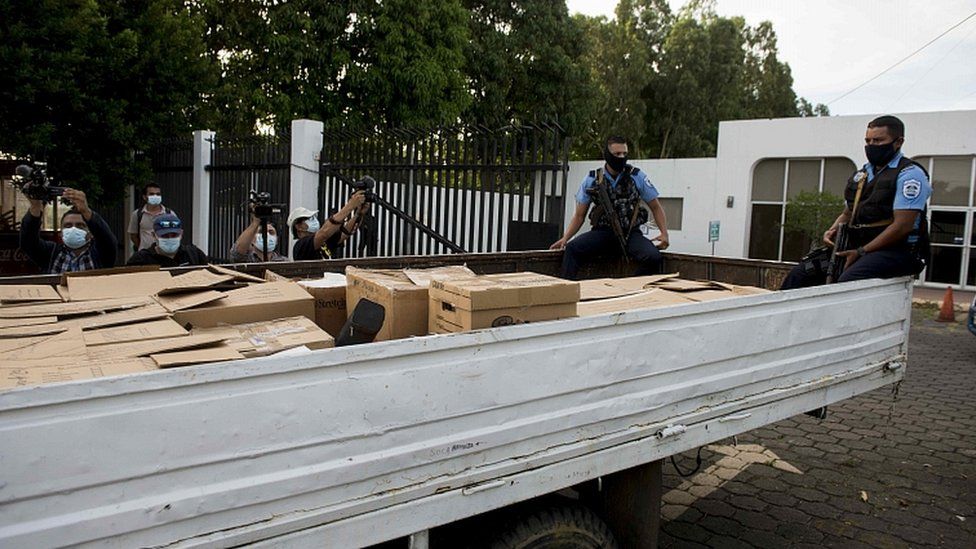 Police agents remove boxes with documents from the newspaper La Prensa after a search operation at the headquarters of the publishing house in Managua, Nicaragua, 13 August 2021