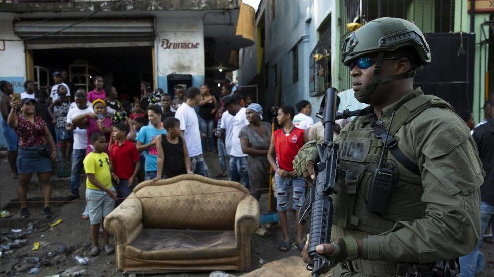 A soldier stands guard during the visit of The President of the Dominican Republic, Luis Abinader, to the Los Ríos neighbourhood flooded by the rains, in Santo Domingo, Dominican Republic, 05 November 2022