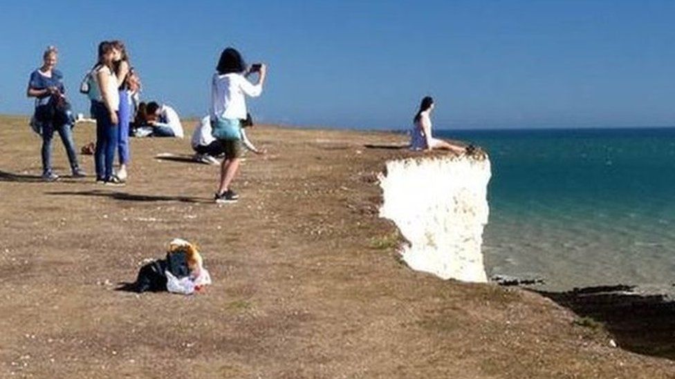 Tourist at cliff edge