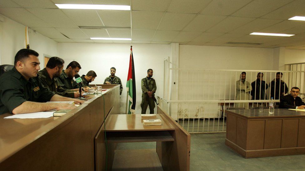 Palestinian military court judges oversee the trial of three men accused of murder in Gaza (19 November 2007)
