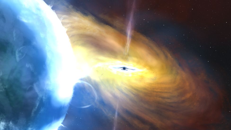 Artists impression of the event - a giant gas cloud sucked into a supermassive black hole