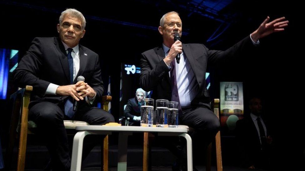 Yair Lapid (L) and Benny Gantz (R) speak to supporters during a Blue and White rally in Tel Aviv on 17 February 2020