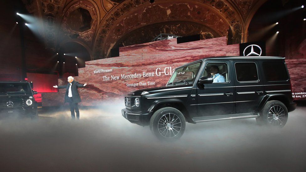 Dieter Zetsche (L), chairman of the board of management of Daimler AG, introduces the 2019 Mercedes-Benz G-Class during a media preview at the North American International Auto Show (NAIAS) in the historic Michigan Theatre on January 14, 2018 in Detroit, Michigan