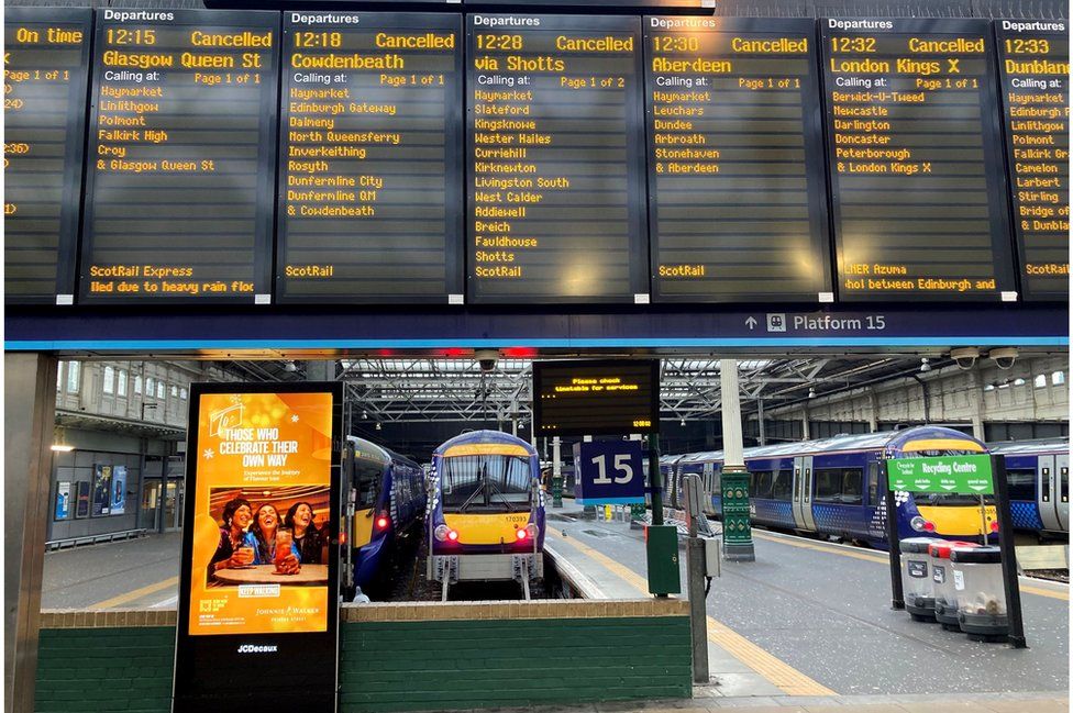 The departure board at Edinburgh Waverley station shows numerous cancellations