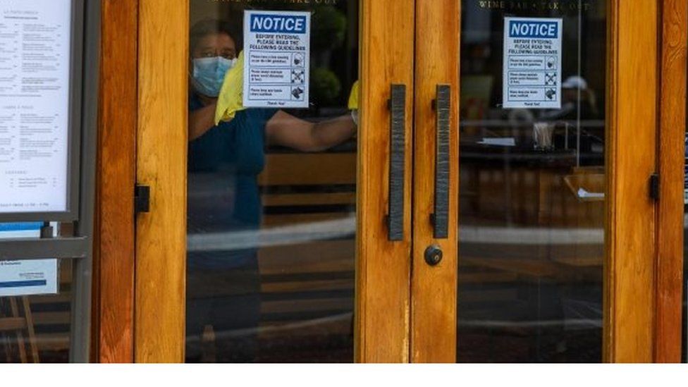 A worker cleans inside a restaurant in Glendale, California. Photo: June 2020