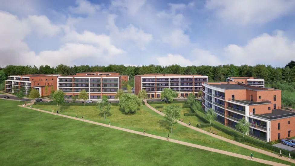 CGI view of four blocks of flats with area of lawn in front. The buildings are all four storeys high and appear to be made of red brick. There are several trees in the large grass area and two paths with people walking on them in the sun. Behind the buildings is a wooded area.