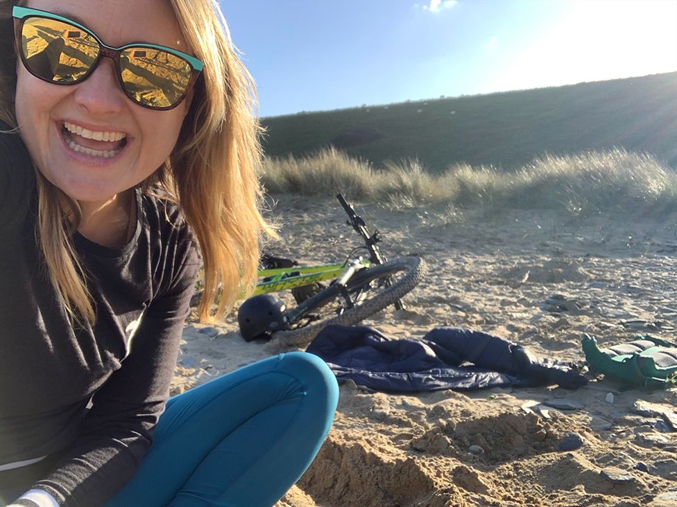 Caroline on a bike ride through the dunes