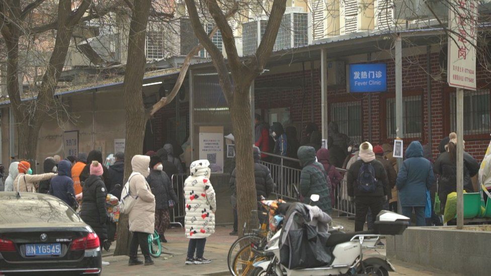 The queue outside a hospital's fever clinic in Beijing on Monday