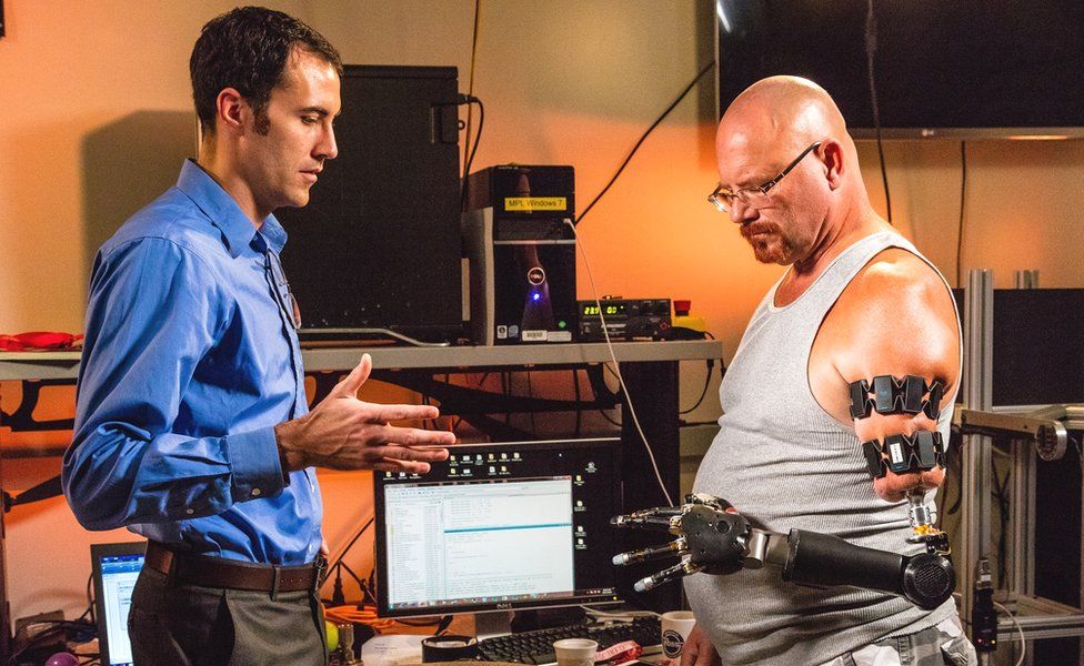 Johnny Matheny tries out his Myo prosthetic hand at John Hopkins University Applied Physics Lab