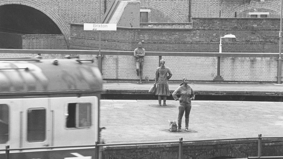 The 'Platforms Piece' statues at Brixton station in the 1980s