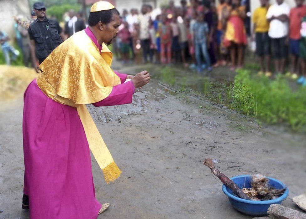 Bishop Nwosu setting fire to artefacts