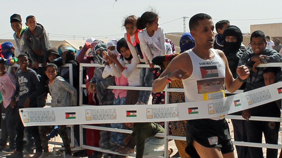 Salah Ameidan crossing the finish line