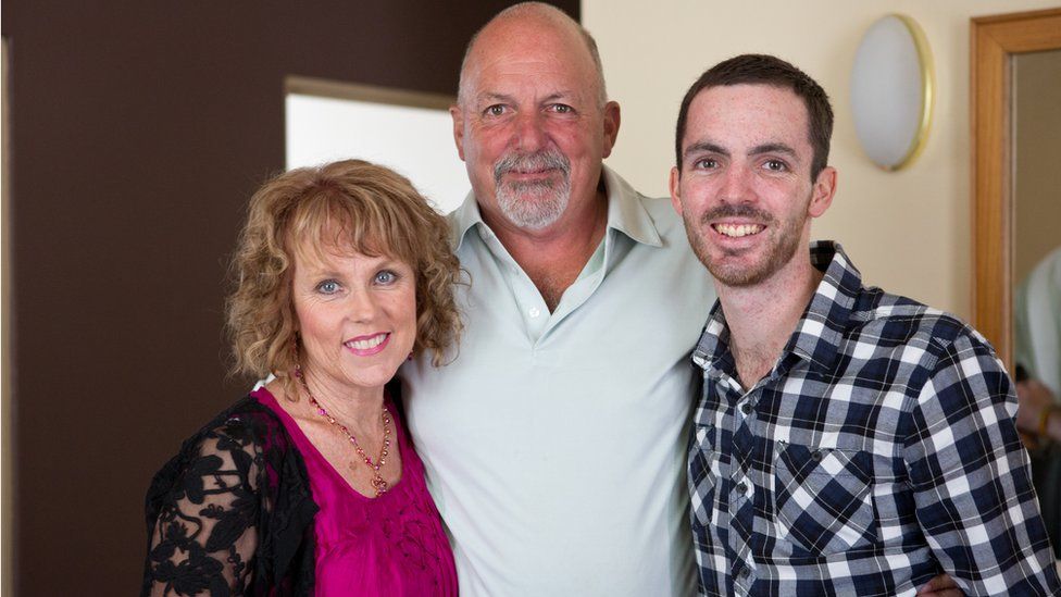 Dan Haslam with his mum and dad