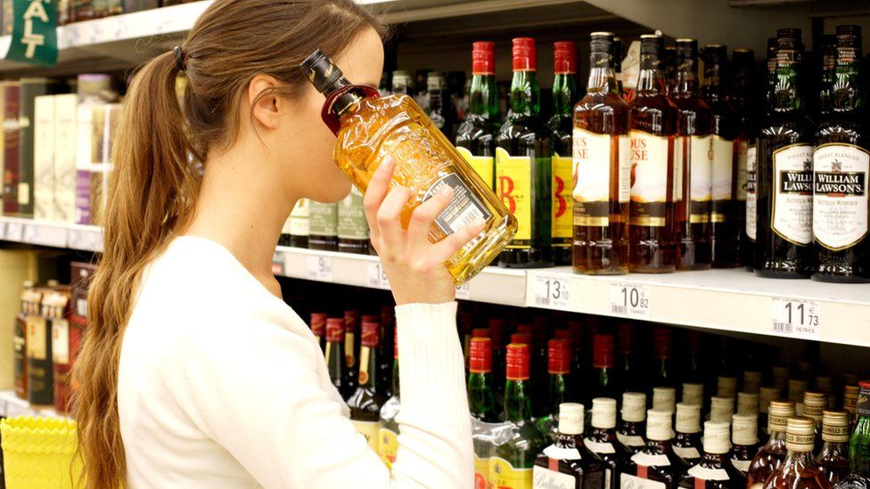 Woman shopping for alcohol