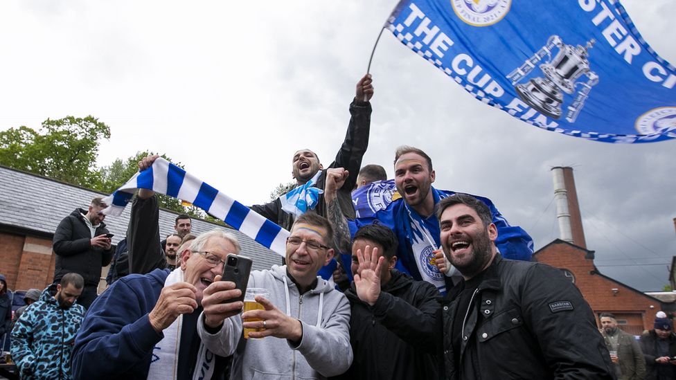 Leicester fans celebrate their teams victory after the FA Cup Final