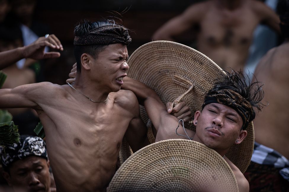 Balinese men take part in the traditional pandanus fighting ritual at Tenganan Pegringsingan village on June 23, 2022 in Bali, Indonesia.
