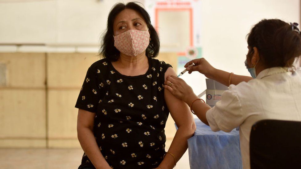 A senior citizen being inoculated with a booster dose of Covid-19 vaccine at district hospital, Sector 30, on June 7, 2022 in Noida, India.