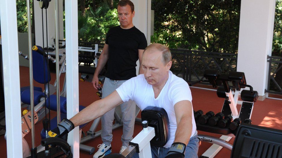 Russias President Vladimir Putin (C) and Russian Prime Minister Dmitry Medvedev work out at a gym at the Bocharov Ruchei state residence in Sochi on August 30, 2015.