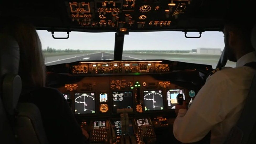 Pilots using simulator