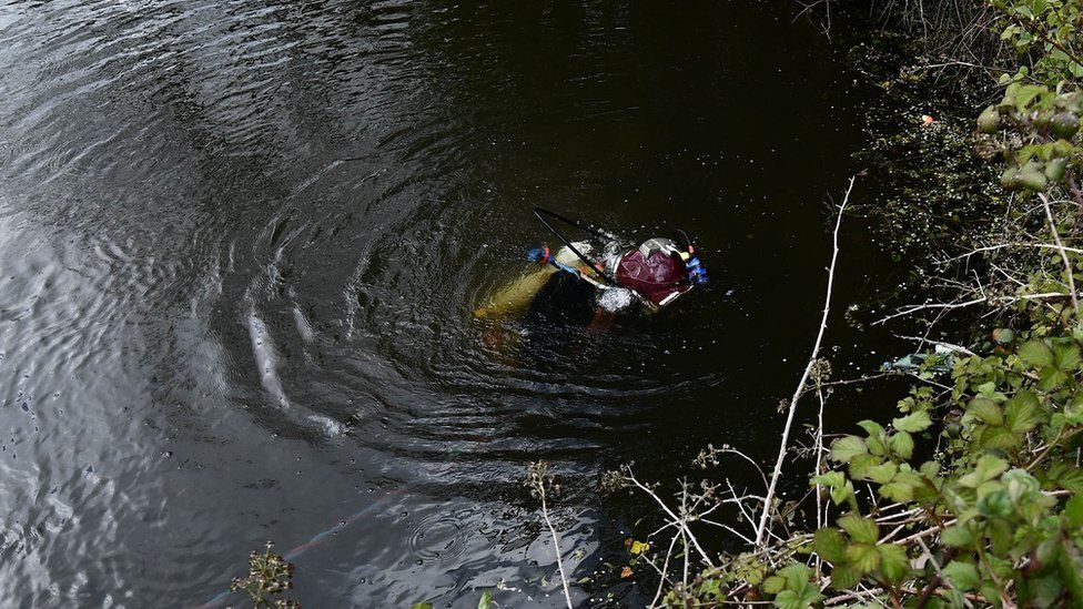 A diver searches in deep water for Lisa Dorrian