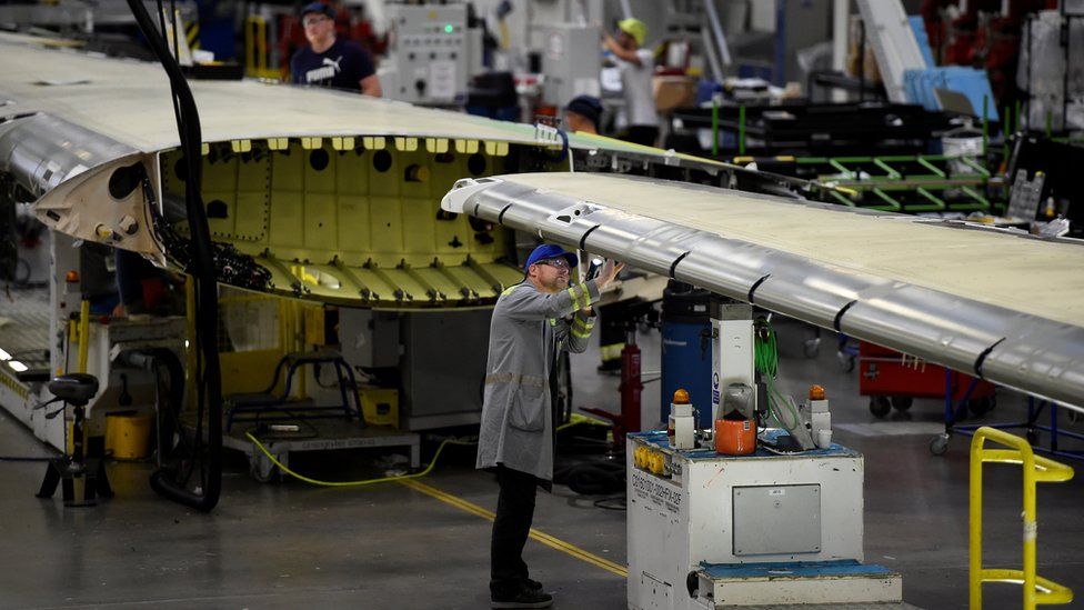 Workers at the Bombardier assemble wings for C-Series planes