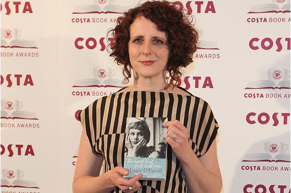 Maggie O'Farrell at the Costa Book Award in 2010 with her book The Hand That First Held Mine