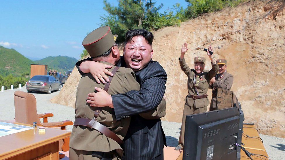 North Korean leader Kim Jong-un celebrates the launch