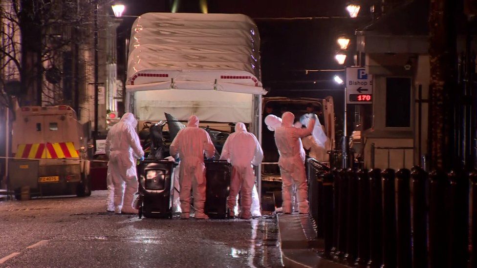 car being removed from scene of derry bomb