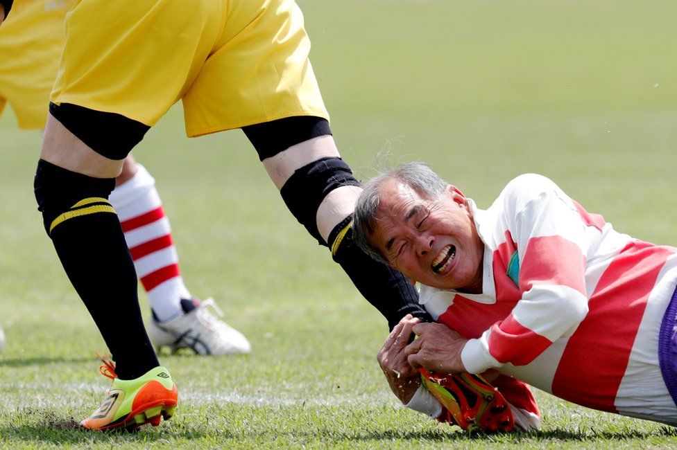 Members of Tokyo's Fuwaku Rugby Club train outdoors