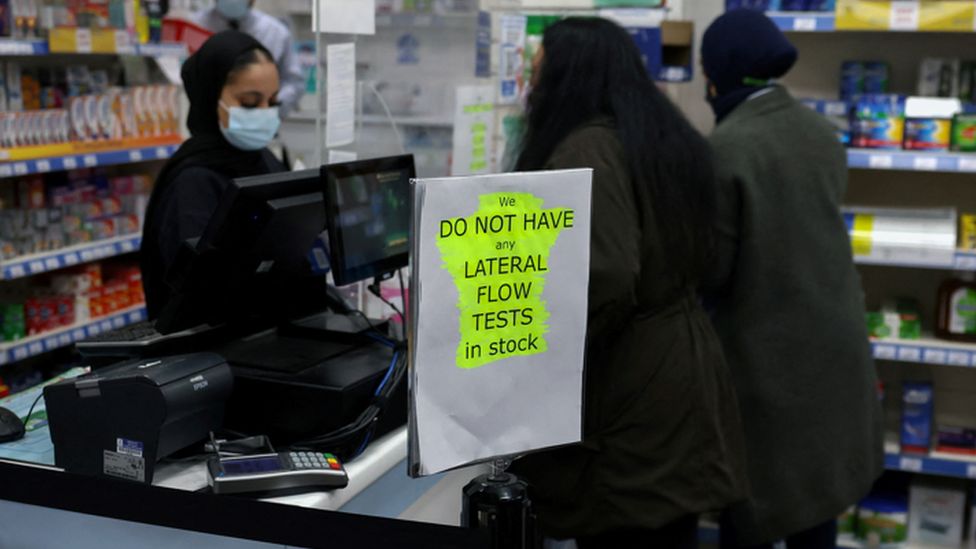 A sign informing customers that lateral flow tests are out of stock is at a pharmacy in London