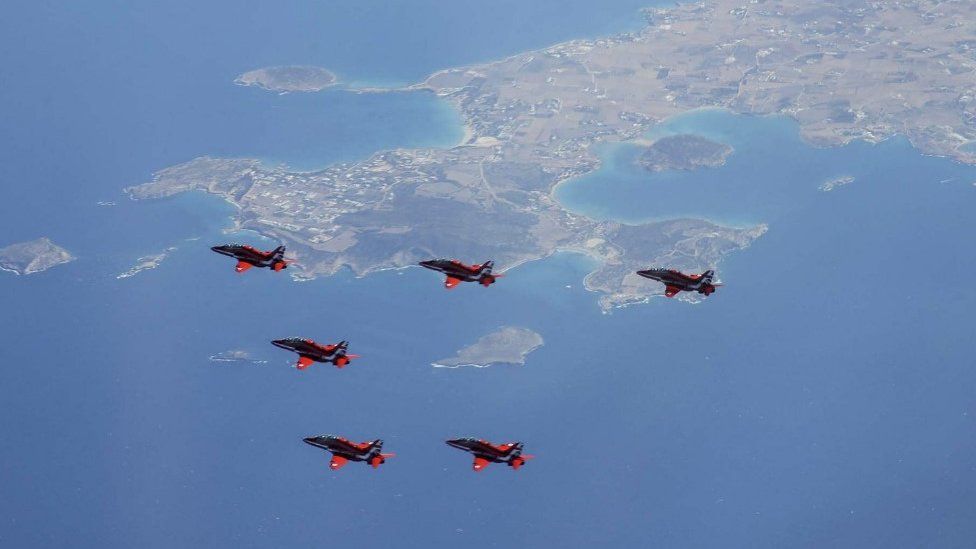 Red Arrows in formation over Greek islands