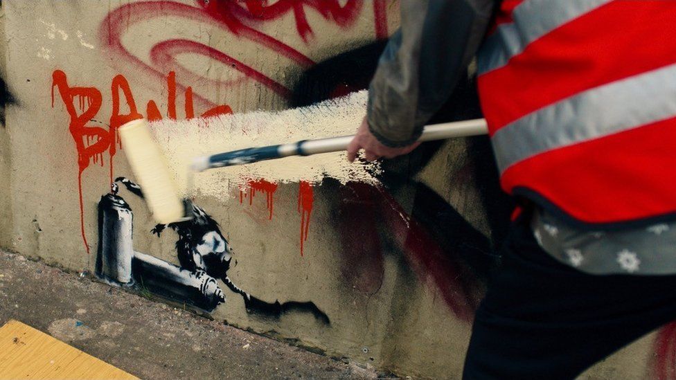 Christopher Walken painting over Banksy's rat