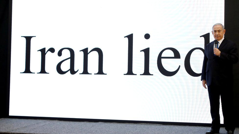 PM Netanyahu in front of a screen bearing the words, "Iran lied"