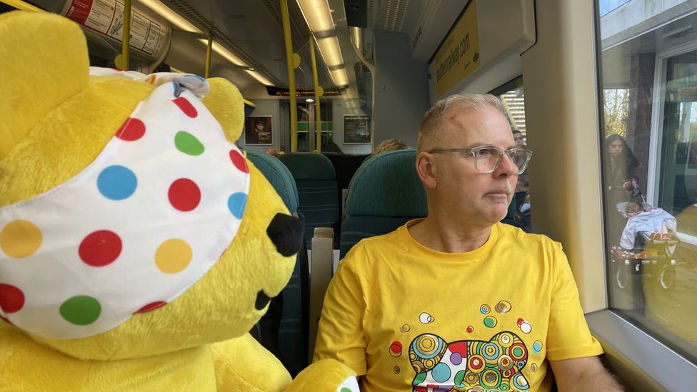 Danny Pike on the train with Pudsey