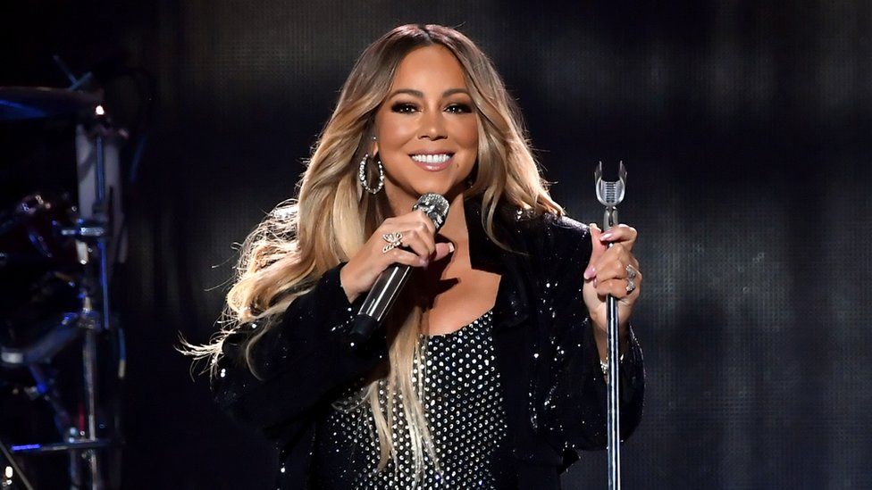 Mariah Carey singing on stage in Saudi Arabia