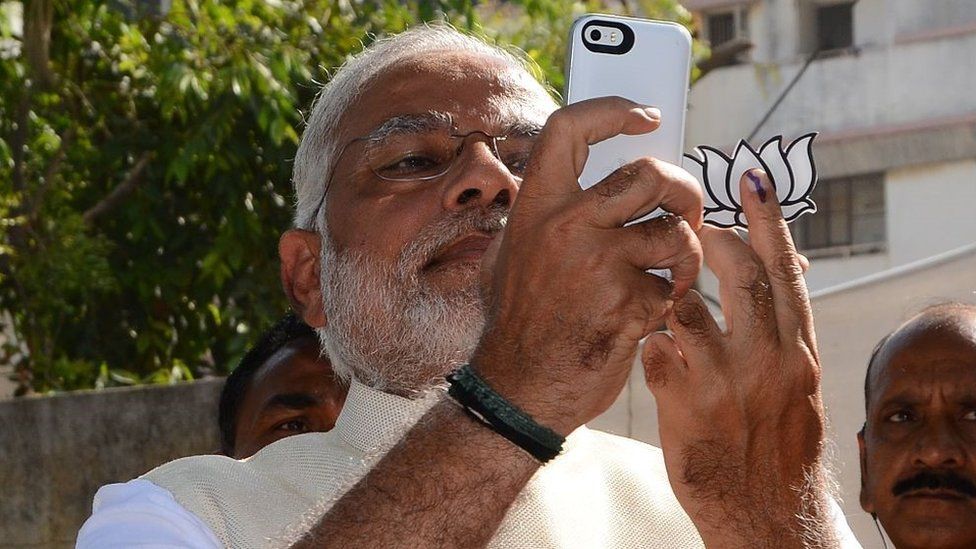 Modi on his phone