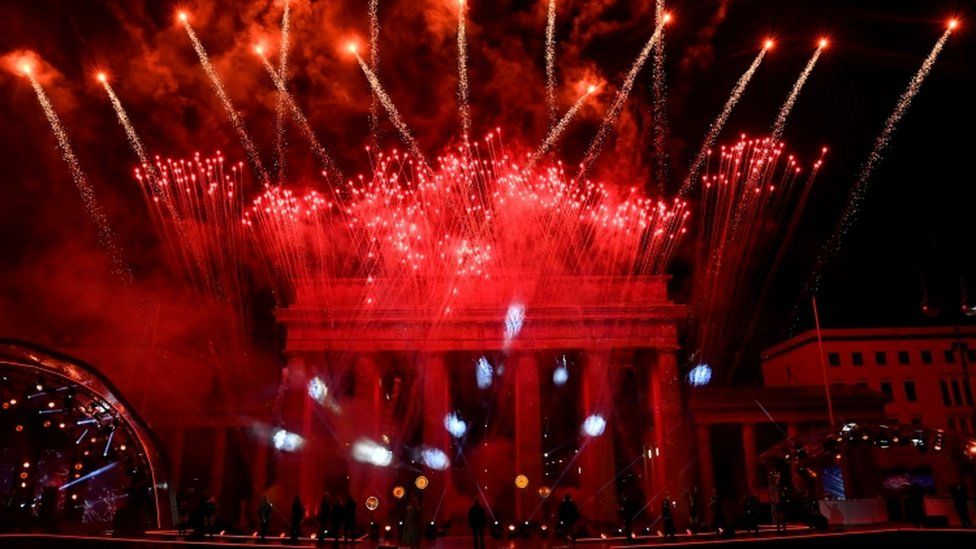 Fireworks explode over Berlin's landmark Brandenburg Gate to usher in the new year