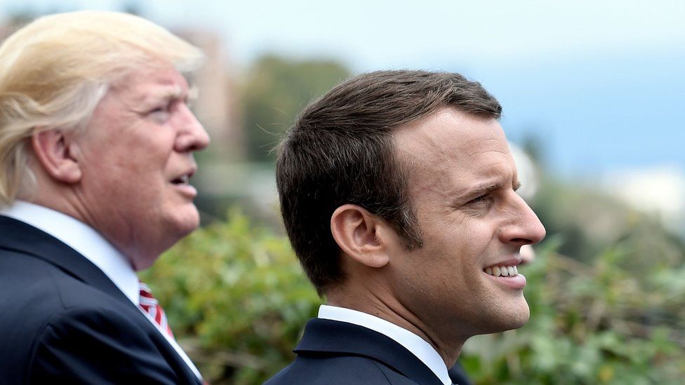 US President Donald Trump (L) and French President Emmanuel Macron watch an Italian flying squadron
