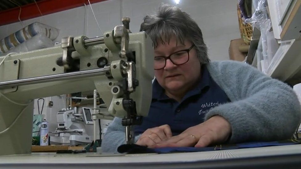 Jackie Owen on a sewing machine