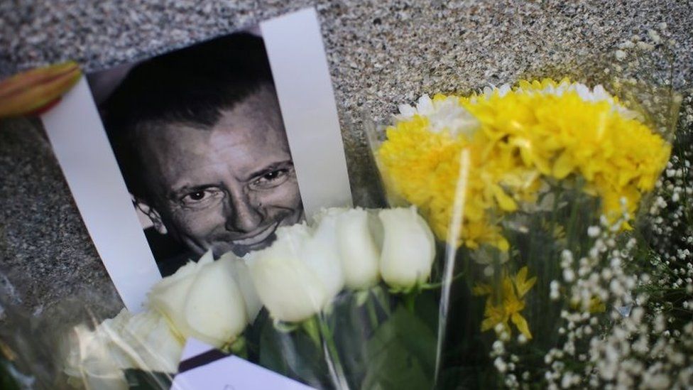 An image of French businessman Baptiste Jacques Daniel Lormand is pictured alongside flowers placed outside the French Embassy after Lormand was found murdered in Mexico City, Mexico, November 29, 2020