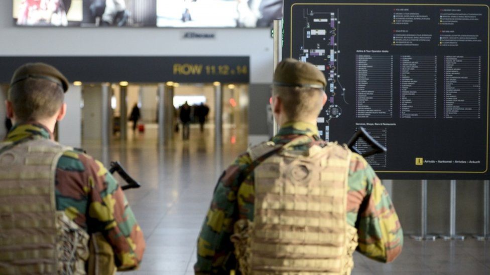 Belgian police forces take part in an operation in Brussels' Zaventem airport, 18 November