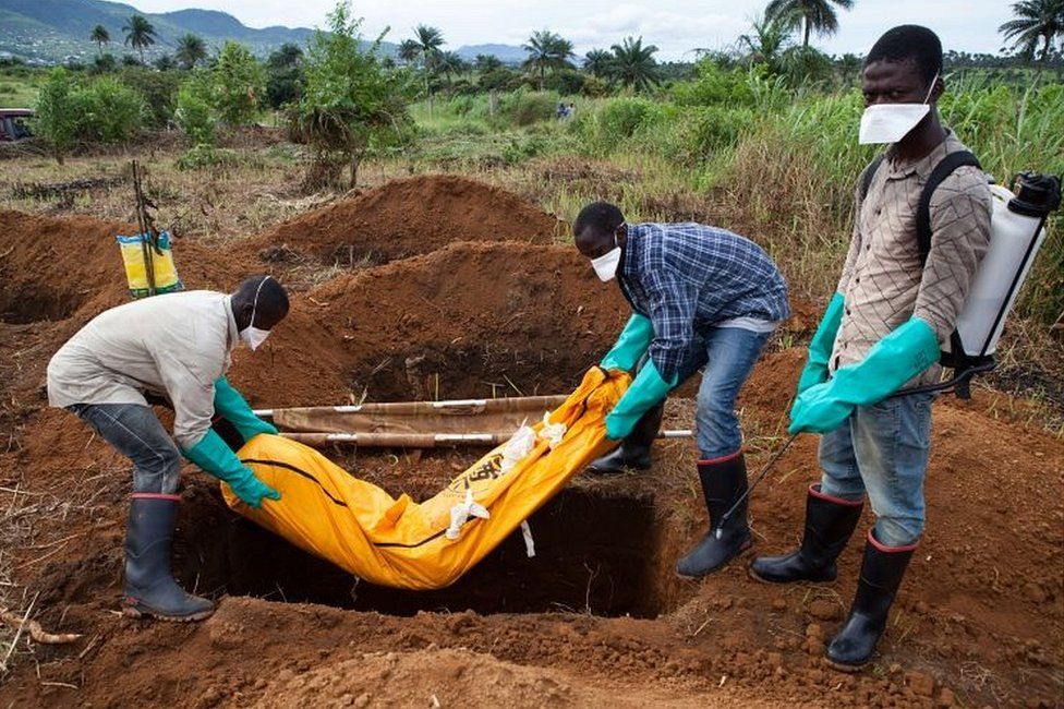 An Ebola victim being buried near Freetown, Sierra Leone, in 2014
