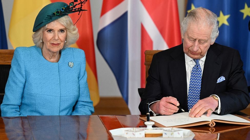 King Charles and Camilla, Queen Consort sign the Golden Book as they visit Schloss Bellevue