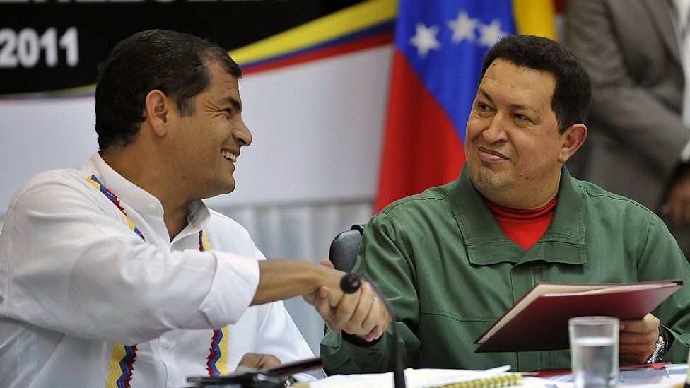 Venezuelan President Hugo Chavez and Ecuadorean President Rafael Correa shake hands at a summit