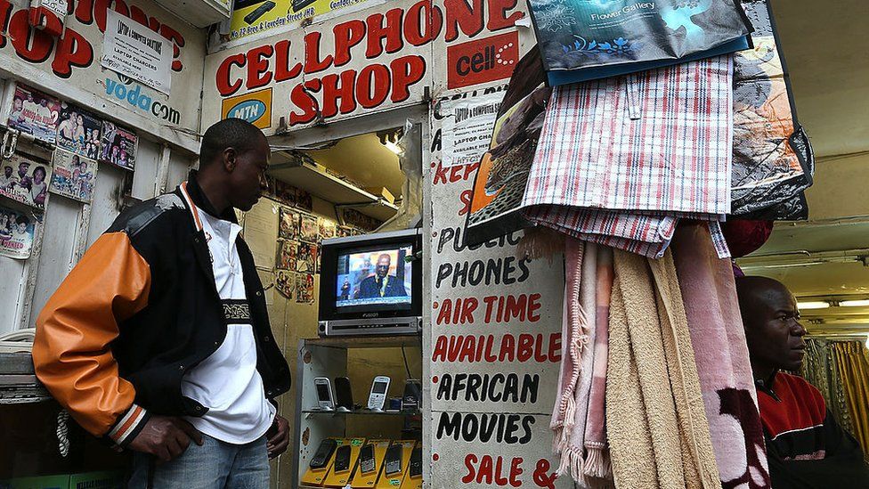 A mobile phone shop worker on December 10, 2013 in Johannesburg, South Africa